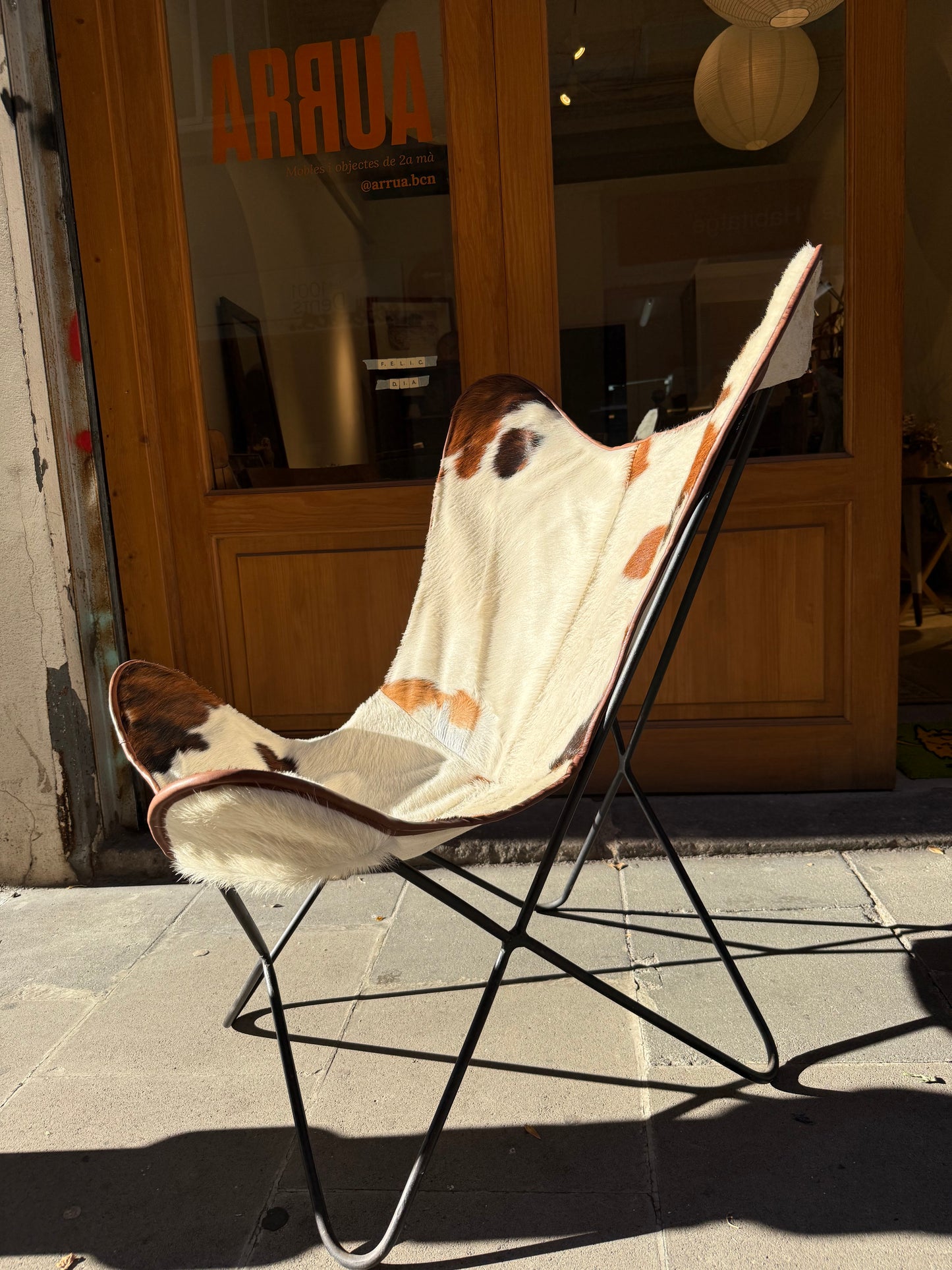 Butaca papallona de pell de vaca