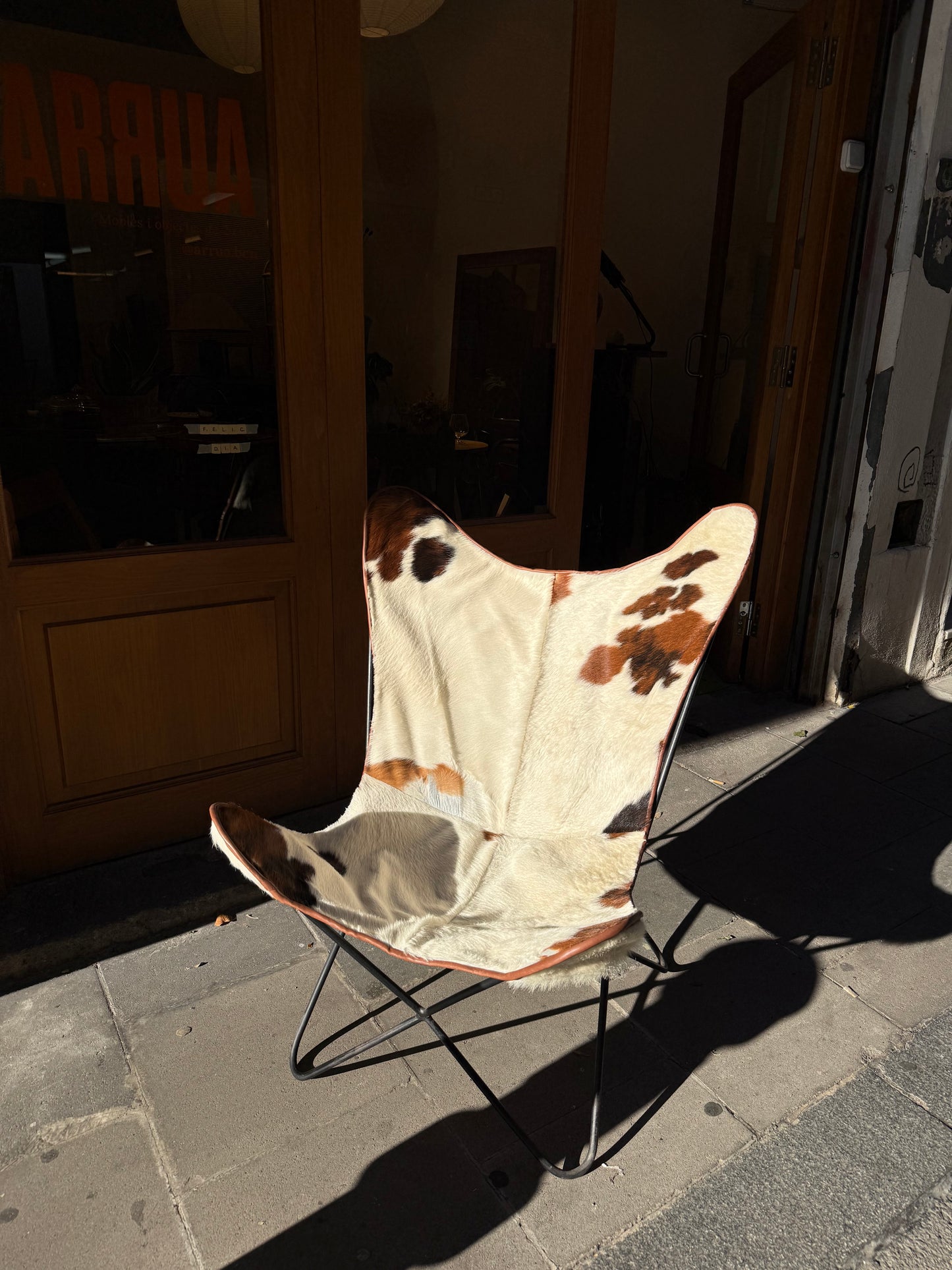 Butaca papallona de pell de vaca